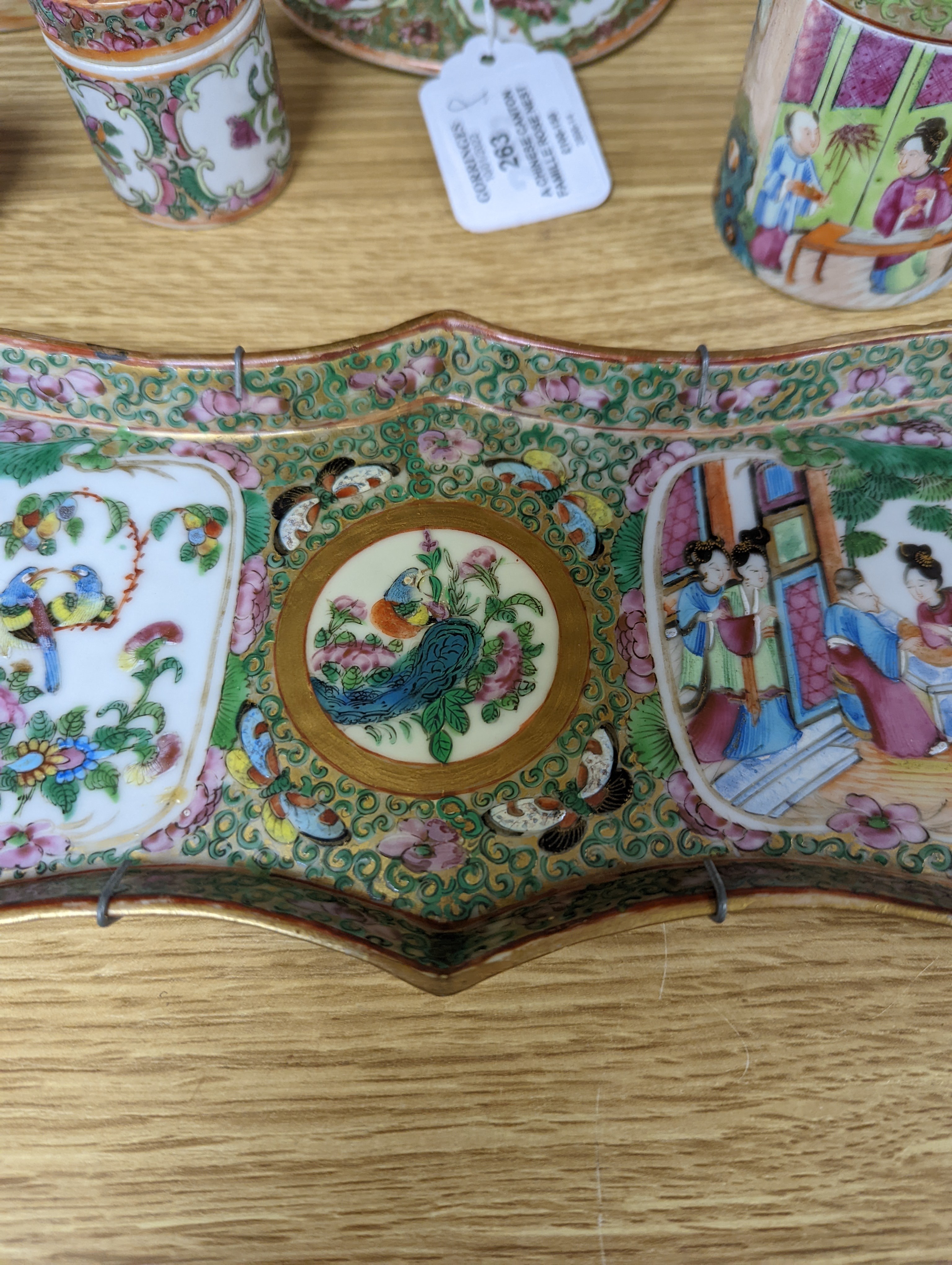 A Chinese Canton famille rose nest of boxes and covers, a similar candlestick and a tray 23cm